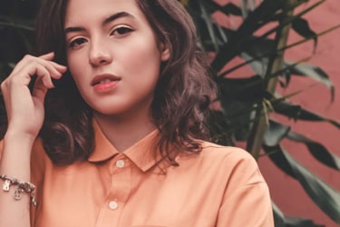 A girl in an orange blouse